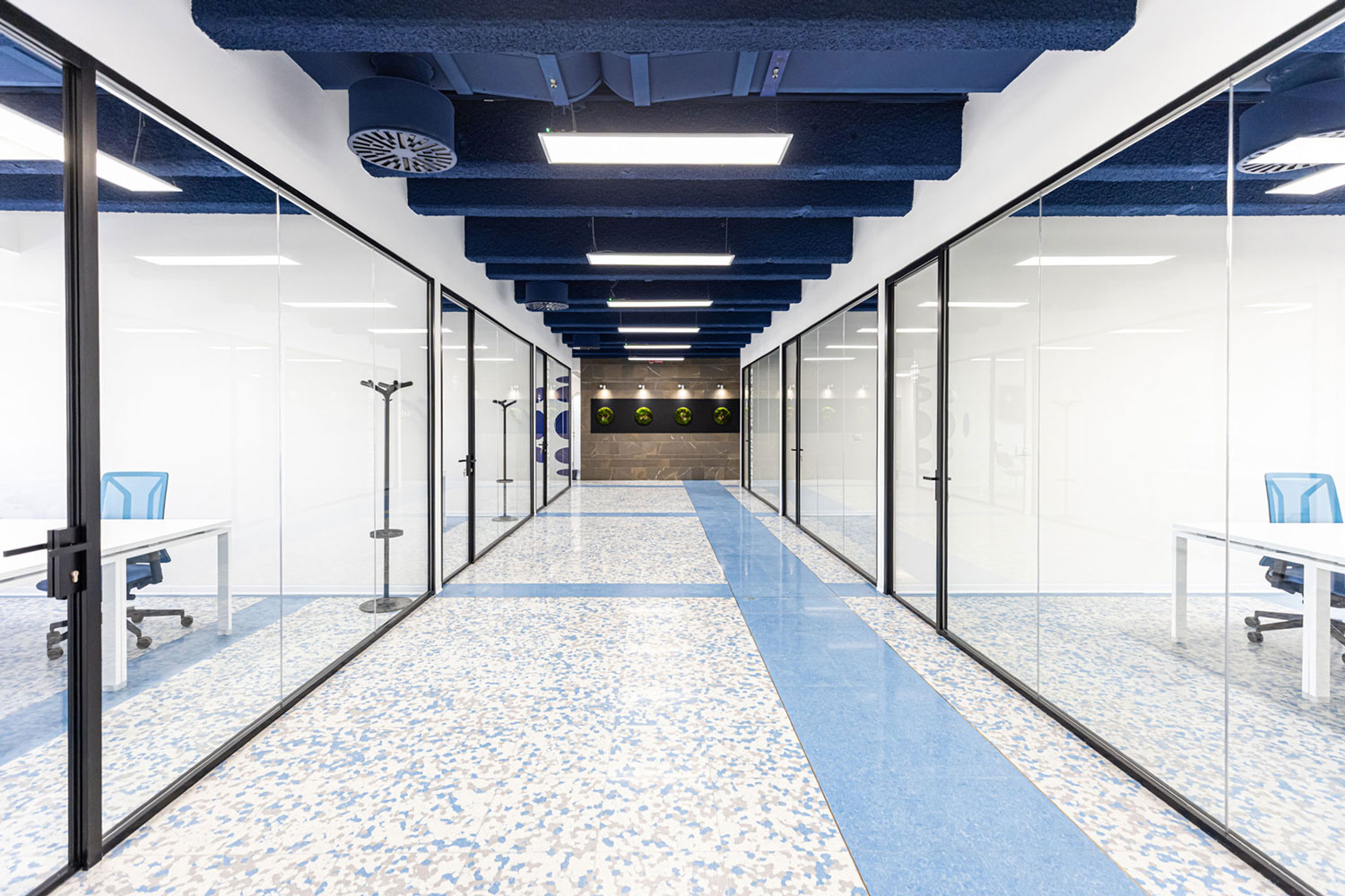 Land in Bo interiors, blue hallway with stained glass windows and doors