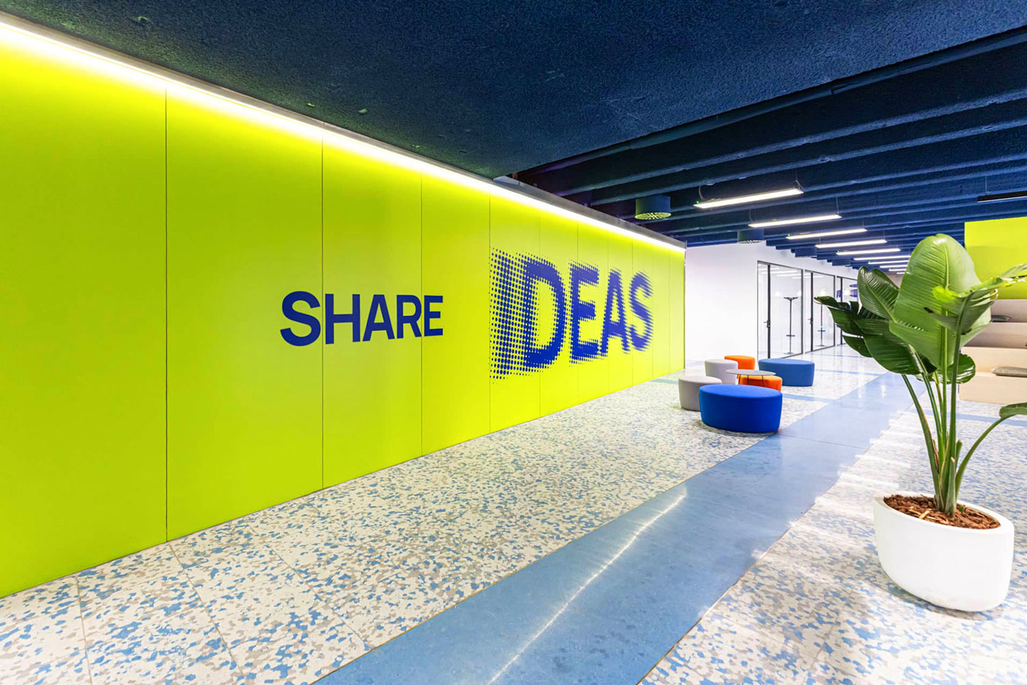 Land in Bo interiors, detail of a yellow wall with pre-spaced vinyl sticker